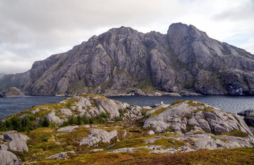 Mountains by the sea in Lofoten, Norway on a cloudy day