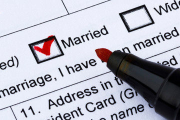 Family status - married. Question in the questionnaire. Red tick and pen