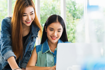 Business meeting. Young asian coworker woman team making business discussion in modern home office. Teamwork people concept. Casual account manager crew working new startup project on laptop