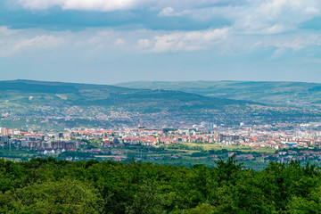 Fototapeta na wymiar Overview of Cluj-Napoca city viewed from Feleac Hill in Cluj-Napoca, Romania