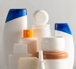 Banner Hair and body care cosmetics white bottles on white background Copy space selective focus