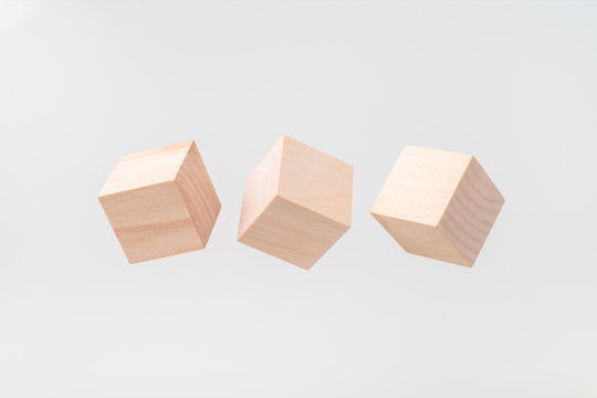 Abstract Floating Wooden Cube On White Background