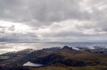 Mountains by the sea in Lofoten, Norway on a cloudy day