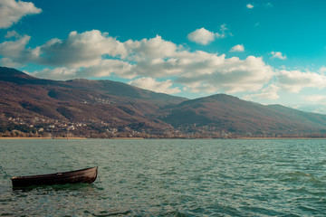Lonely wooden boat in Ohrid Lake on sunny day - 244249141