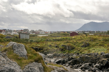 Fototapeta na wymiar Mountains by the sea in Lofoten, Norway on a cloudy day