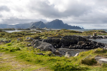 Mountains by the sea in Lofoten, Norway on a cloudy day