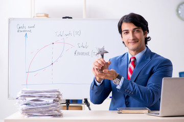 Busy businessman explaining business charts