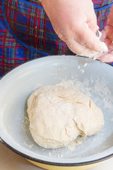 Mix the dough with your hands in a bowl