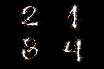 Long exposure underexposed photo of lightpainting bengali fire numbers one two three and four. Lighdrawing photo. Soft focus and a lot of lines.