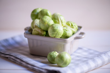 a pile of Brussels sprouts on a white background close up