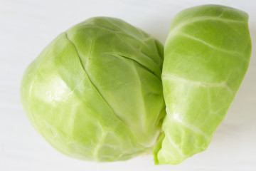 Obraz premium brussels sprouts isolated on white wooden background