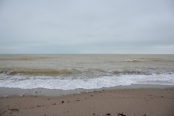 Winter sea and the beach in shades of creme brulee