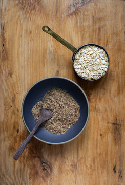 Bowl of whole grain uncooked oats and flax seed