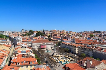 The view of the city from from Santa Justa Lift  on a sunny summer day. The roofs of the houses and Rossio Square.