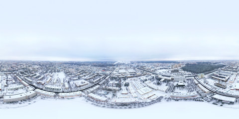 aerial panoramic view of Minsk city residential area under construction against grey winter sky background