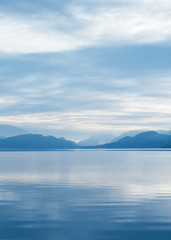 Fototapeta na wymiar Silhoutte of mountains with sky reflected on calm lake
