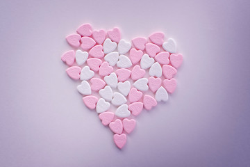 Valentine pastel pink and white heart candies shaped in a big heart