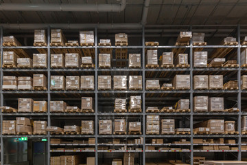Warehouse interior with shelves rack for keep production material, pallets and boxes.