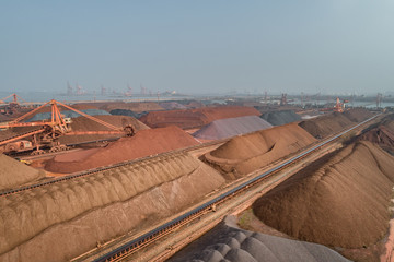 aerial view of ore and conveyor belt at an industrial port