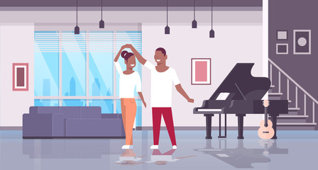 couple dancing man woman happy lovers home hall musical instruments piano guitar modern apartment interior african american male female characters full length flat horizontal
