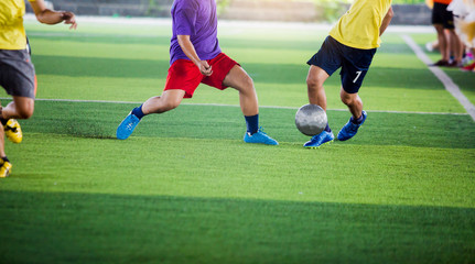 soccer players run to trap and control the ball for shoot to goal.