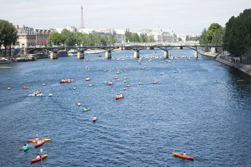 Kayaks on the River Seine in Paris with the Eiffel Tower visible in the background