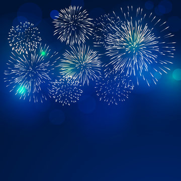 brightly colorful fireworks with pale smoke from fire on twilight background