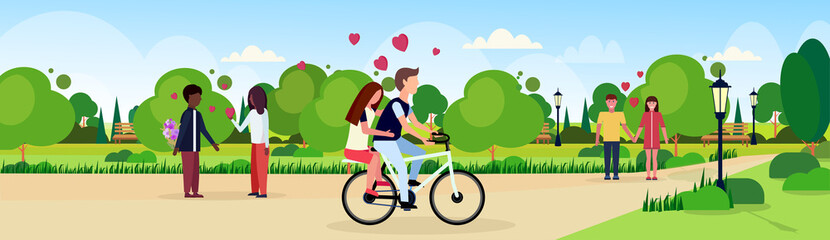 couples in love riding bicycle walking celebrating happy valentines day holiday concept mix race men women lovers in city urban park landscape background flat horizontal