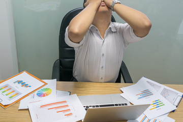 Businessman feels overstressed and exhausted because of working under high-pressure