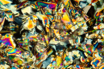 Fototapeta na wymiar Abstract micrograph of colorful crystals of the amino acid phenylalanine.