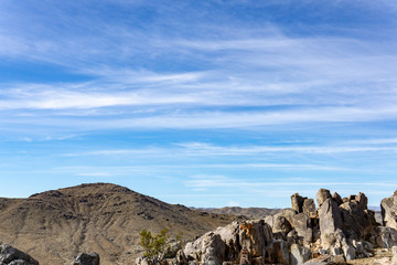 Blue sky landscape with a rocky foreground