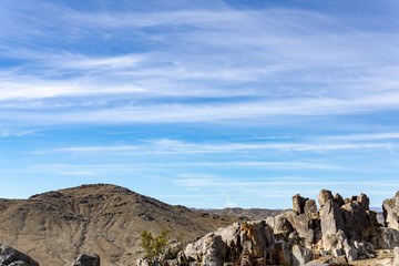 Blue sky landscape with a rocky foreground