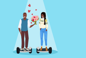 couple riding electric scooter happy valentines day concept man giving woman flowers bouquet driving personal transport hover board african characters full length horizontal flat