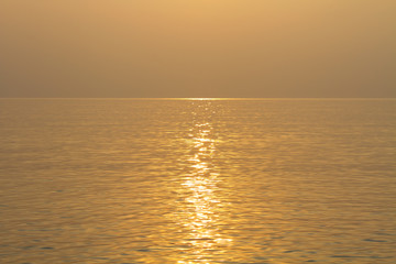 Dreamlike sea covered with dust at sunset. Wave pattern background.