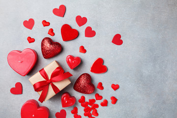 Valentines day background with gift box and red hearts.