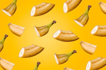 Bananas sliced ​​on a yellow background. Minimal fruit concept