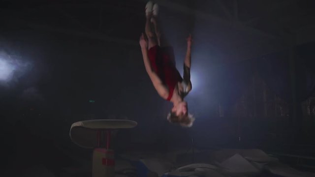 Gymnast gymnastic somersault exercise HD slow-motion video. Athlete salto