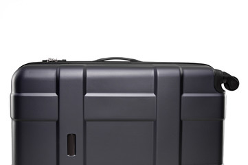 Fragment of black plastic valise on wheels isolated on white background