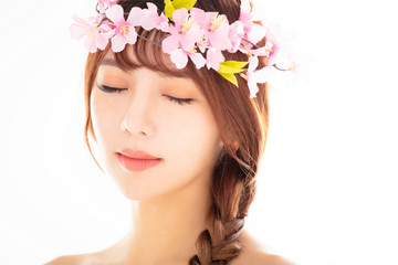 closeup young smiling beauty face with flower