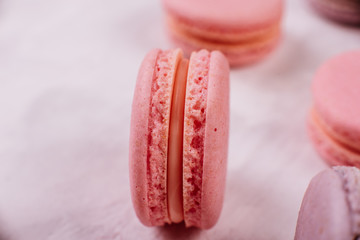 Wedding, St. Valentine's Day, birthday, preparation, holiday. Beautiful pink tasty macaroons on a concrete background