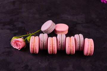 Wedding, St. Valentine's Day, birthday, preparation, holiday. Beautiful pink tasty macaroons on a concrete background