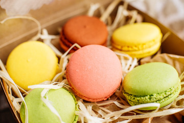 Wedding, St. Valentine's Day, birthday, preparation, holiday. Beautiful pink tasty macaroons on a concrete background
