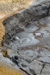 Boiling and bubbling grey mud pool at Hverir and Namaskard geothermal area, Diamond Circle, Iceland