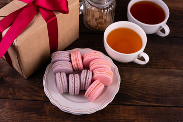 Wedding, St. Valentine's Day, birthday, preparation, holiday. Beautiful pink tasty macaroons on a concrete background