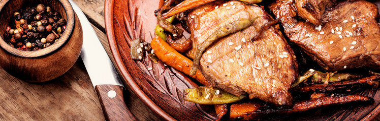 Beef steaks with vegetables