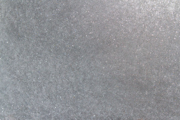 Frozen window photographed in the evening with a flicker of color