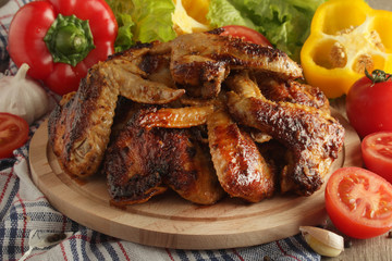 Chicken wings barbecue with different vegetables