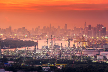 Fototapeta na wymiar Oil gas refinery manufacturing industry plant in twilight scene in Bangkok city of Thailand., Business factory petrochemical or energy power industrial and heavy construction onshore in cityscape.