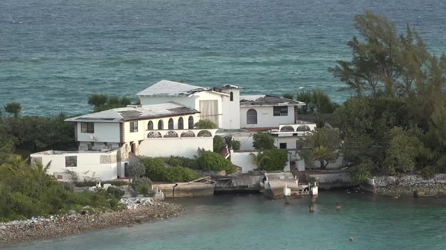 An island with a cottage in the Bahamas.