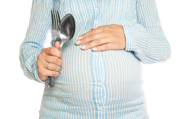 Happy pregnant girl lies on white background